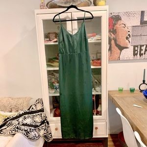 Silky forest green gown with feather detail on back. Pit to pit: 18.5